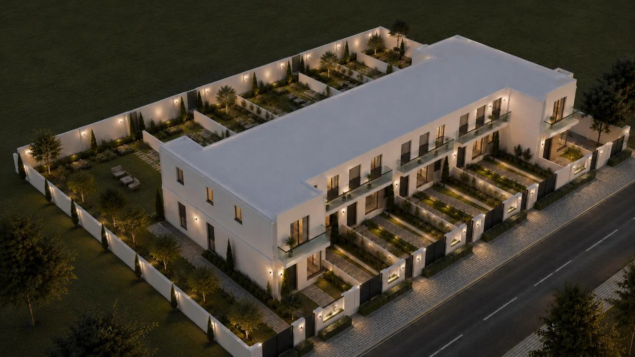 Vista aérea nocturna del conjunto completo de Residencial Plenilunio: las cinco viviendas pareadas, con el perímetro cerrado e iluminado